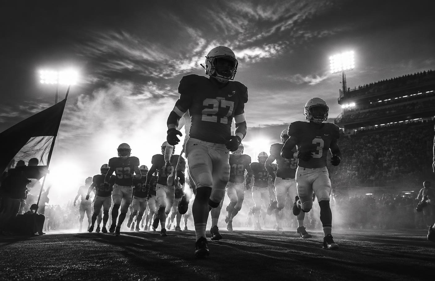 College football team taking the field